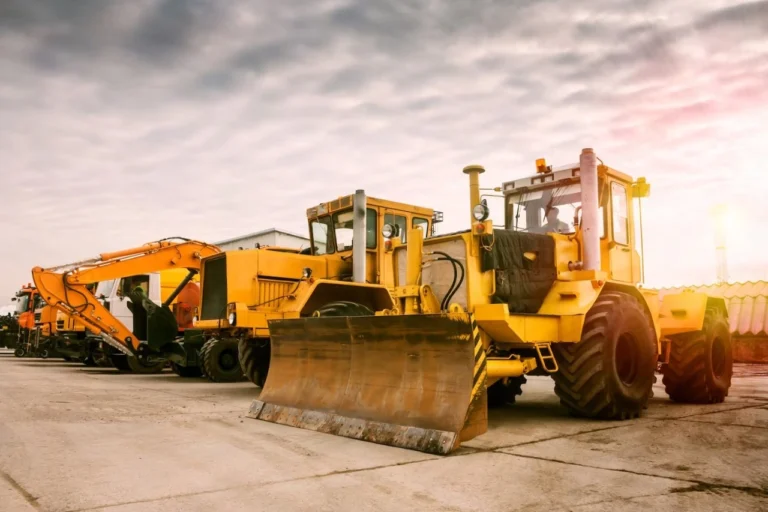 two-heavy-wheeled-tractor-one-excavator-other-construction-machinery-morning-sun_527900-17